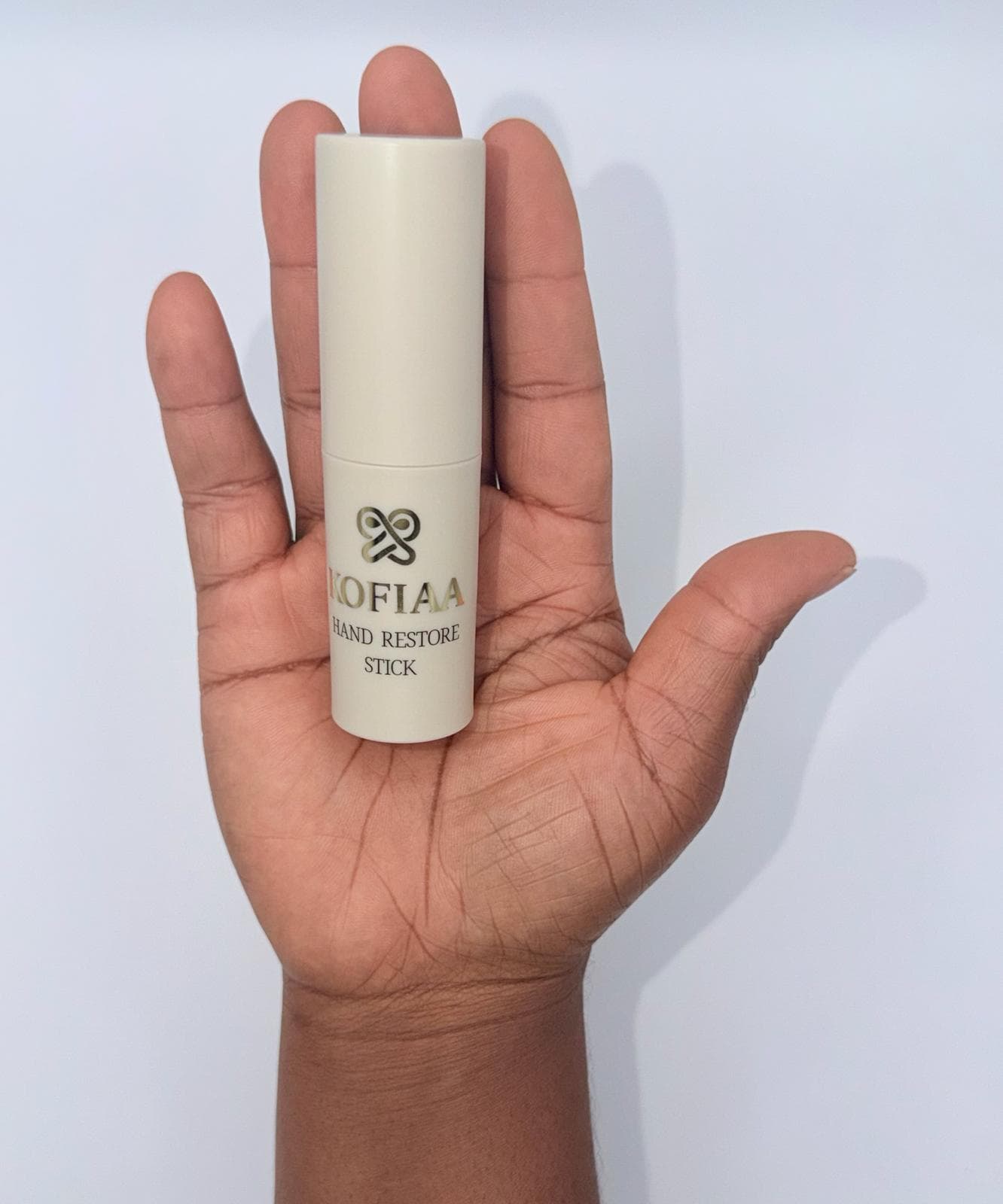 KOFIAA Hand Restore Stick held in hand